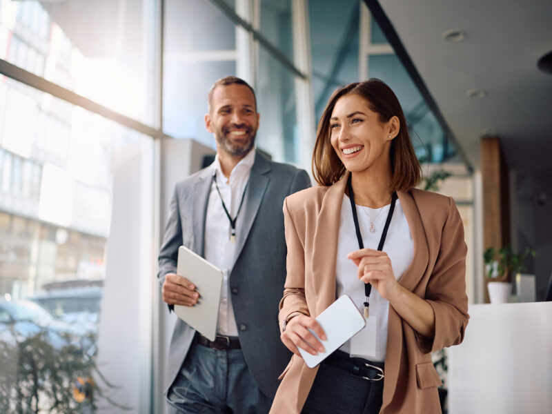 Happy,Businesswoman,With,A,Colleague,Working,In,The,Office.,Copy