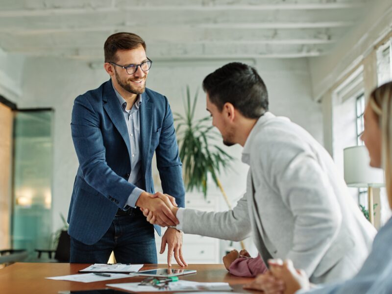 Portrait,Of,A,Young,Businessman,Businessmen,Shaking,Hands,Introducing,Each